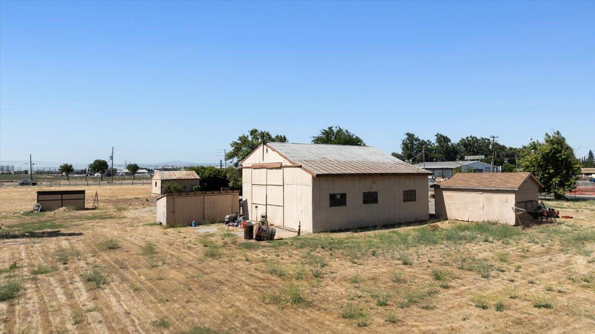 140 Swanson Road Manteca, CA 95337 - Photo 16 of 26 a view of a white house with a yard