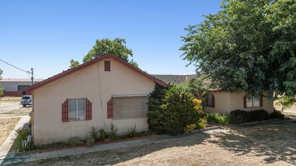 140 Swanson Road Manteca, CA 95337 - Photo 19 of 26 a front view of a house with a yard