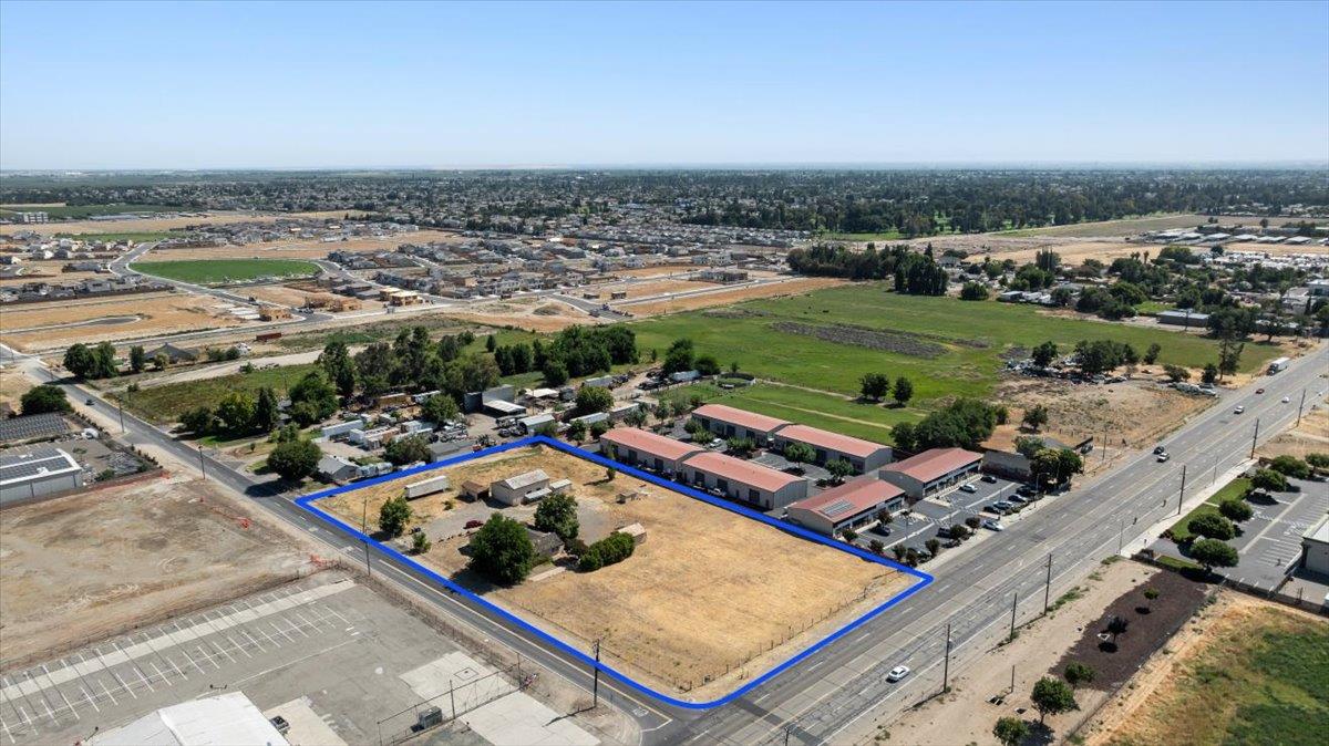 140 Swanson Road Manteca, CA 95337 - Photo 21 of 26 an aerial view of a pool yard and mountain view in back