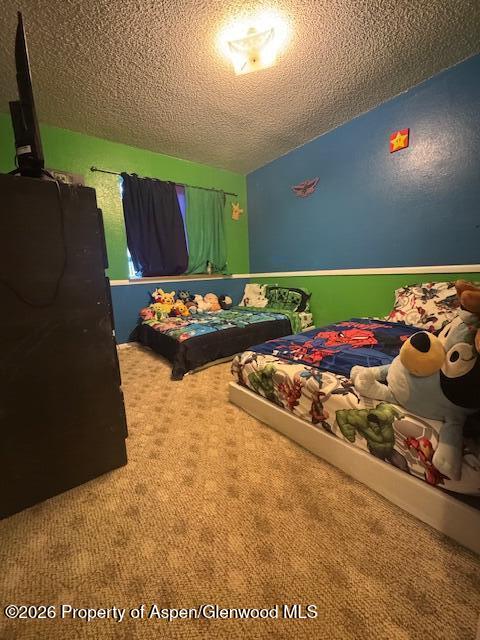 1018 East 7th Street Craig, CO 81625 - Photo 4 of 10 a bed sitting in a bedroom next to a window