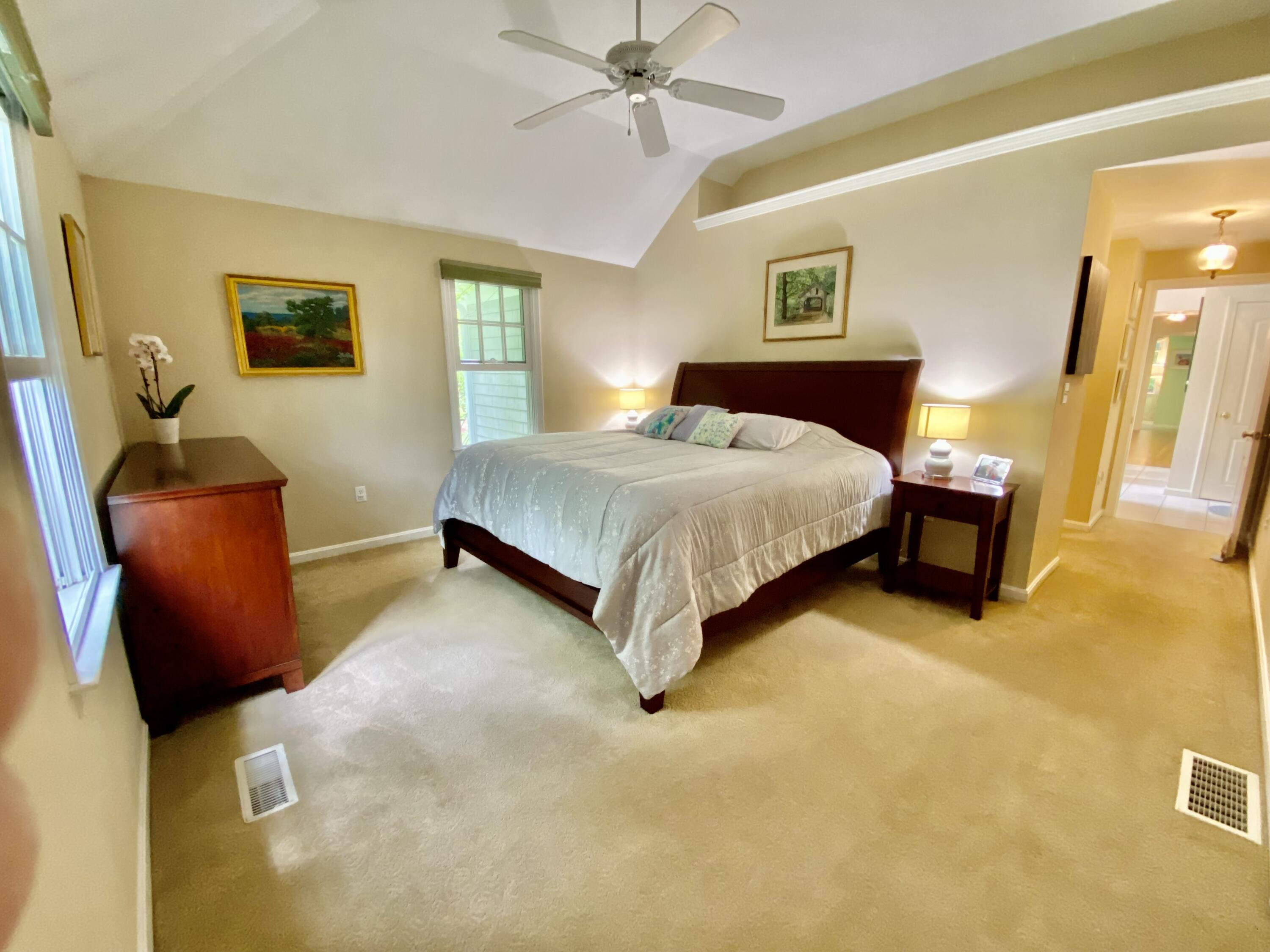 5 Oldham Road Osterville, MA 02655 - Photo 13 of 29 a bedroom with a bed and a chandelier