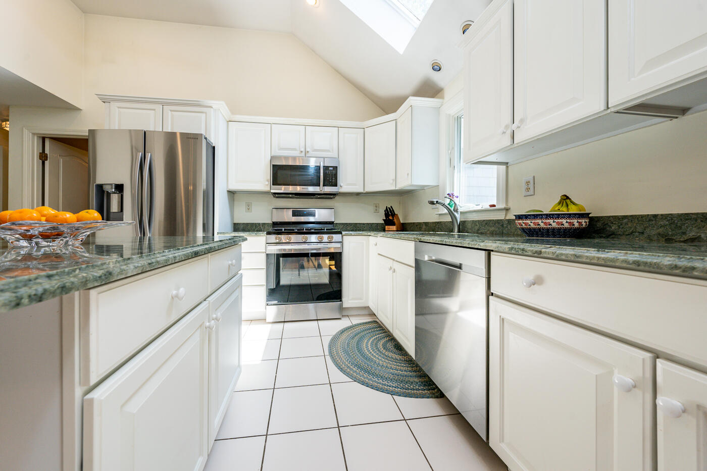 5 Oldham Road Osterville, MA 02655 - Photo 8 of 29 a kitchen with stainless steel appliances granite countertop a sink stove refrigerator and cabinets