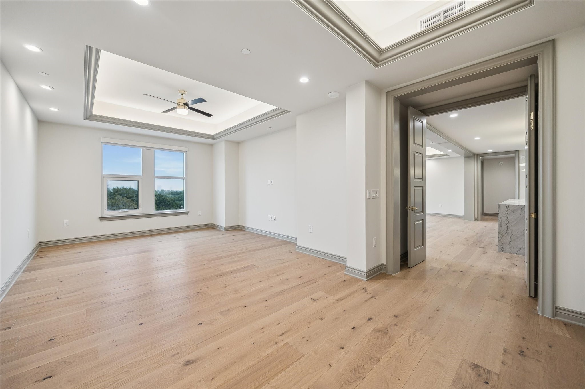 1717 Bissonnet Street, Unit 508 Houston, TX 77005 - Photo 11 of 34 a view of empty room with wooden floor and fan