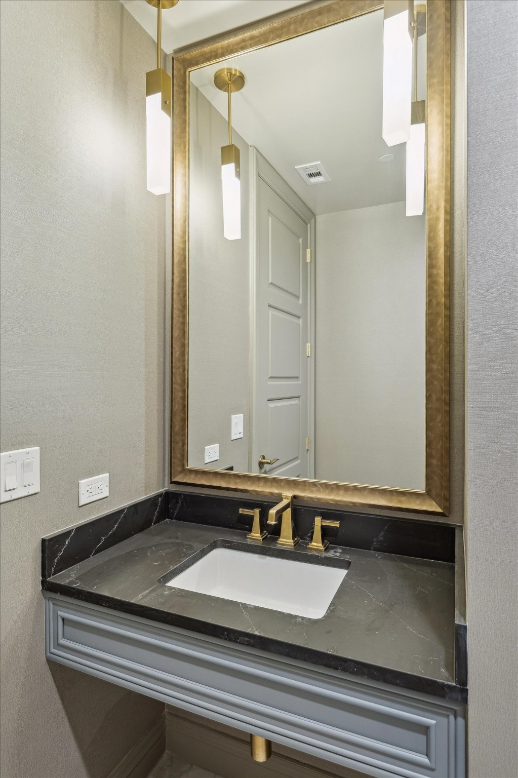 1717 Bissonnet Street, Unit 508 Houston, TX 77005 - Photo 25 of 34 a bathroom with a granite countertop sink and a mirror