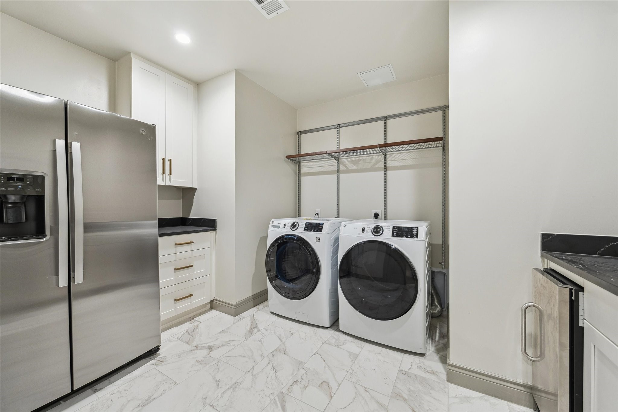 1717 Bissonnet Street, Unit 508 Houston, TX 77005 - Photo 26 of 34 a utility room with dryer and washer