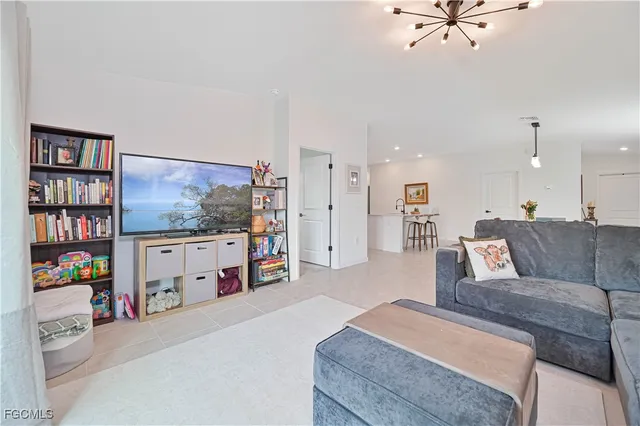 a kitchen with stainless steel appliances a sink a stove a refrigerator cabinets and a counter space