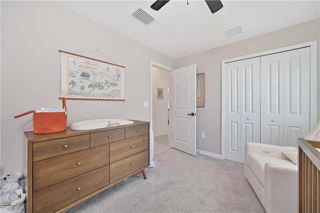 a bedroom with a bed dresser and a window