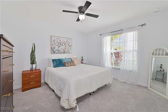 a bedroom with a bed and a mirror