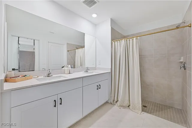 a bathroom with a toilet a sink and a mirror