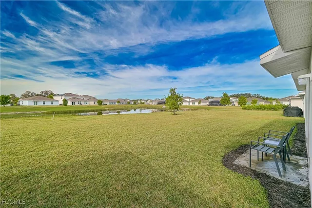a view of a dining room with furniture wooden floor and chandelier