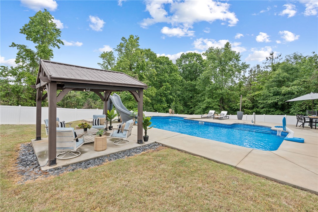 1050 Old Dacusville Road Easley, SC 29640 - Photo 27 of 33 This private outdoor oasis features a refreshing pool and a dedicated shaded patio area.