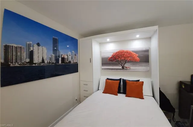 a bed room with a bed and dresser