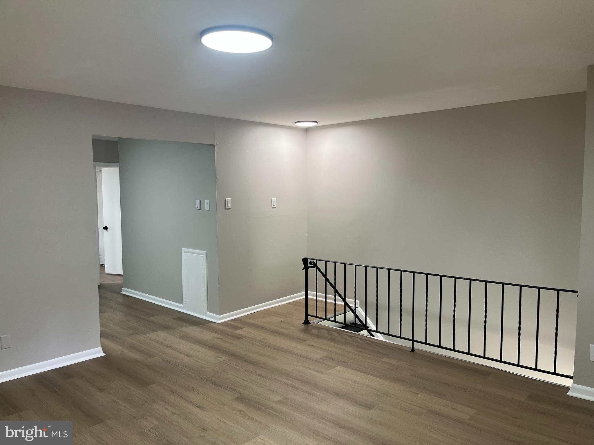 319 Columbia Avenue, Unit 227 Stratford, NJ 08084 - Photo 12 of 13 wooden floor in an empty room
