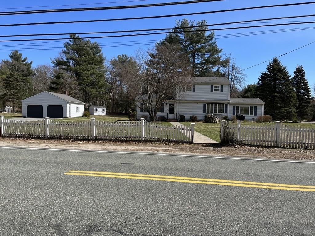 2550 Bay Road Stoughton, MA 02072 - Photo 1 of 20 a view of a house with a swimming pool and wooden fence