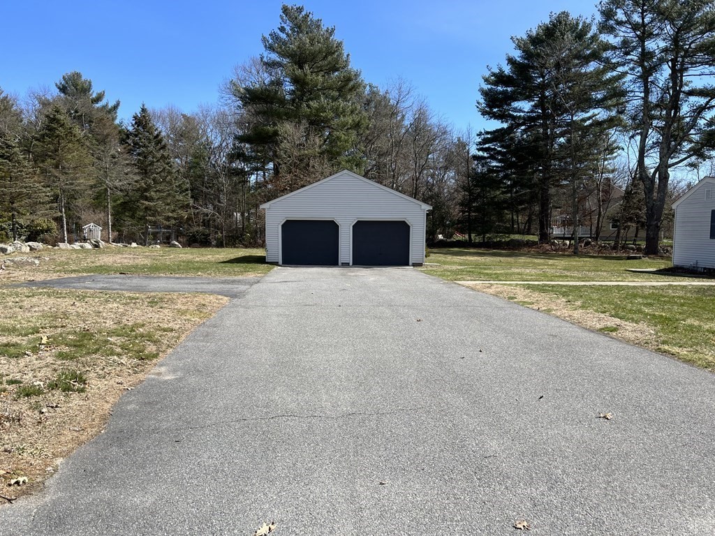 2550 Bay Road Stoughton, MA 02072 - Photo 2 of 20 a big white house with a yard and large trees