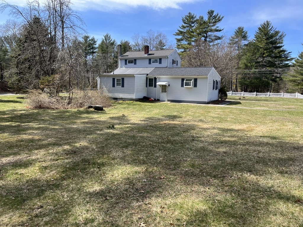 2550 Bay Road Stoughton, MA 02072 - Photo 6 of 20 a front view of a house with a garden