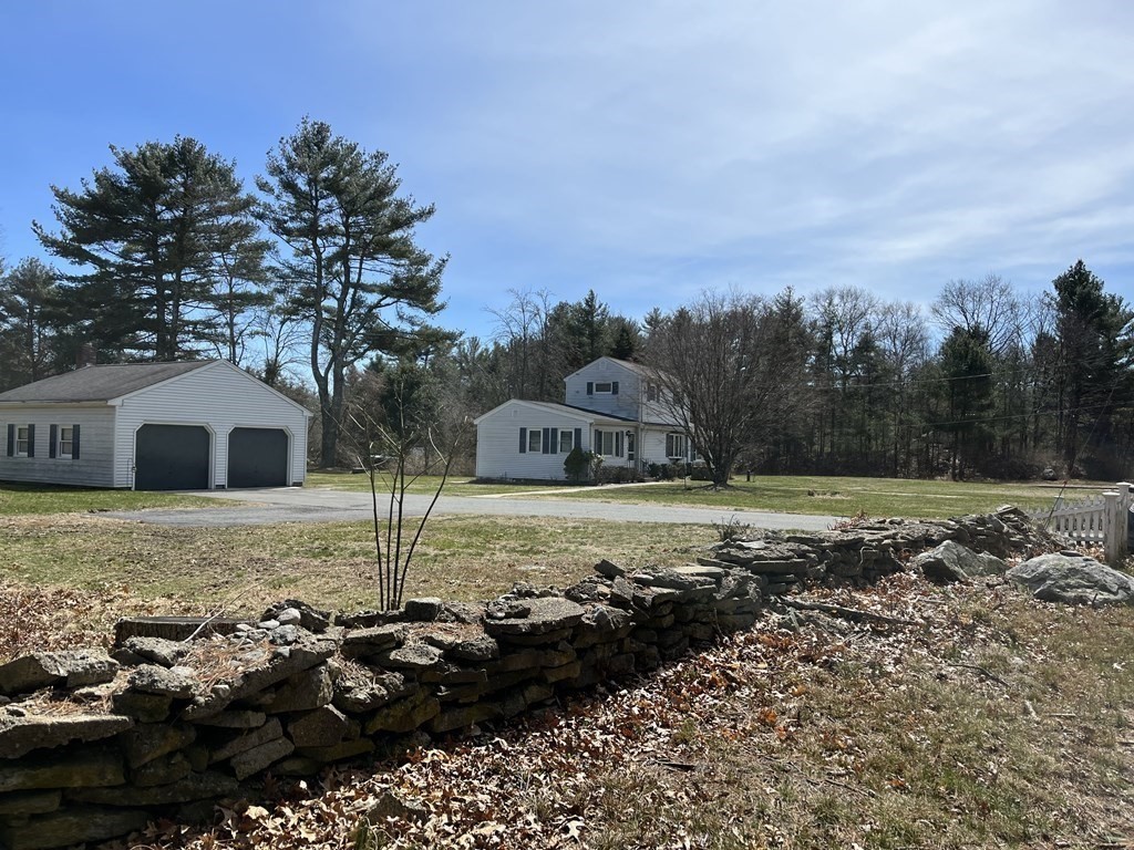 2550 Bay Road Stoughton, MA 02072 - Photo 7 of 20 a front view of a house with a yard