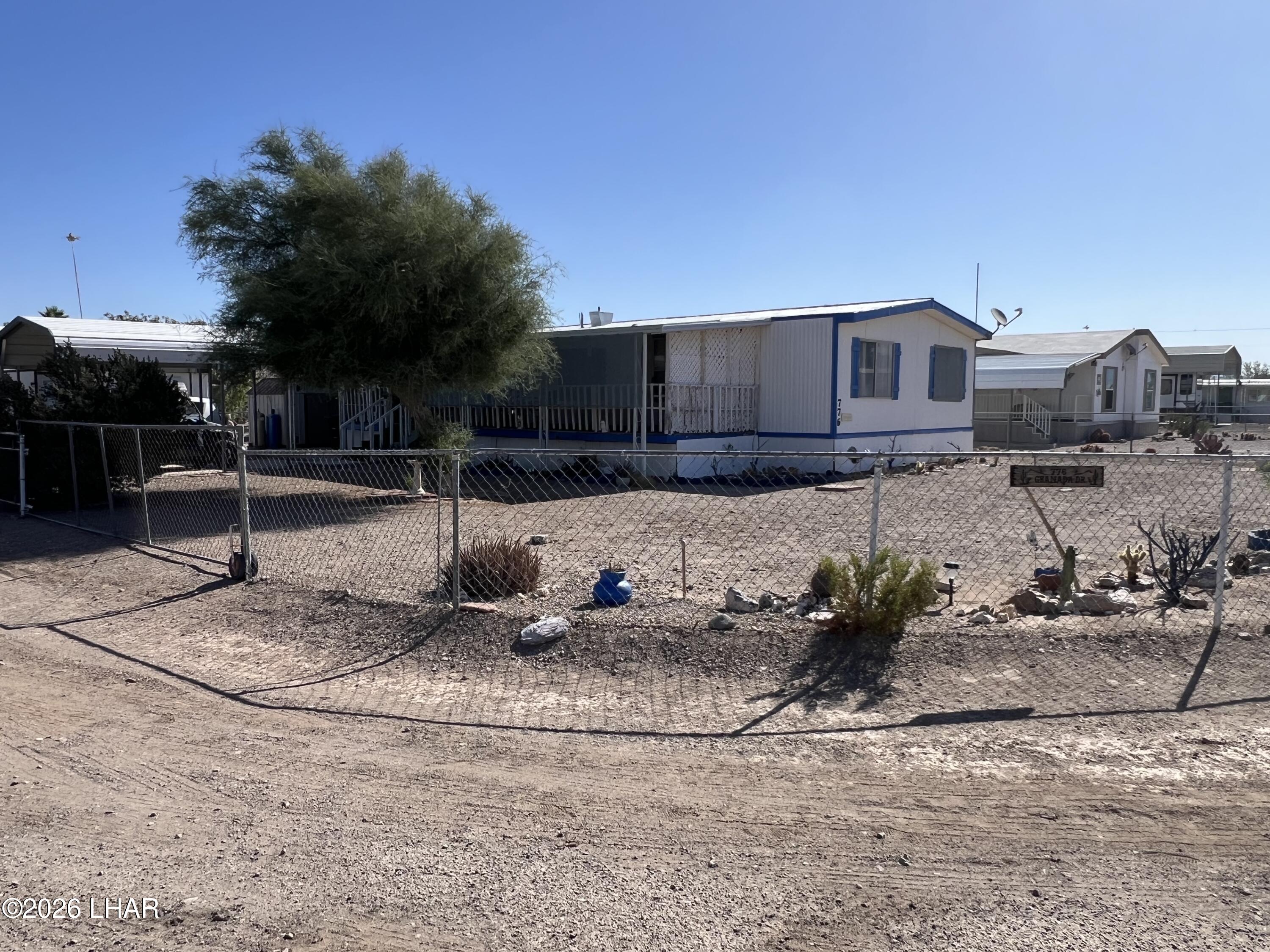 776 Granada Drive Quartzsite, AZ 85346 - Photo 1 of 39 Your new home with keys to new adventures right across the street!