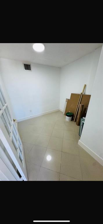 1130 11th Street, Unit 6J Miami Beach, FL 33139 - Photo 14 of 18 a view of a room with wooden floor