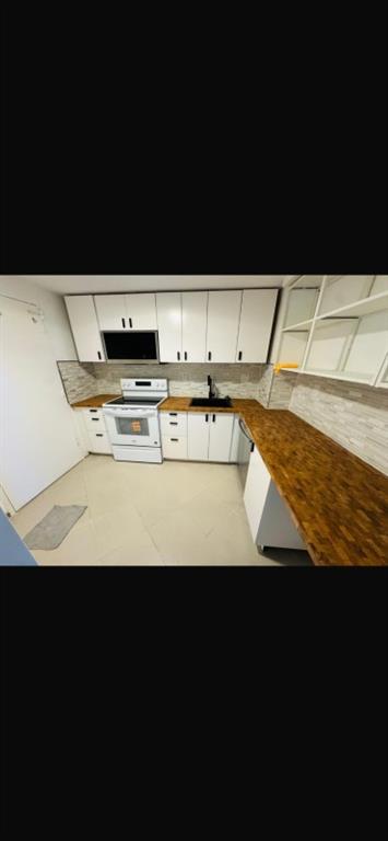 1130 11th Street, Unit 6J Miami Beach, FL 33139 - Photo 2 of 18 a view of kitchen island with wooden floor