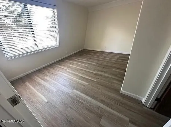 a view of an empty room and window