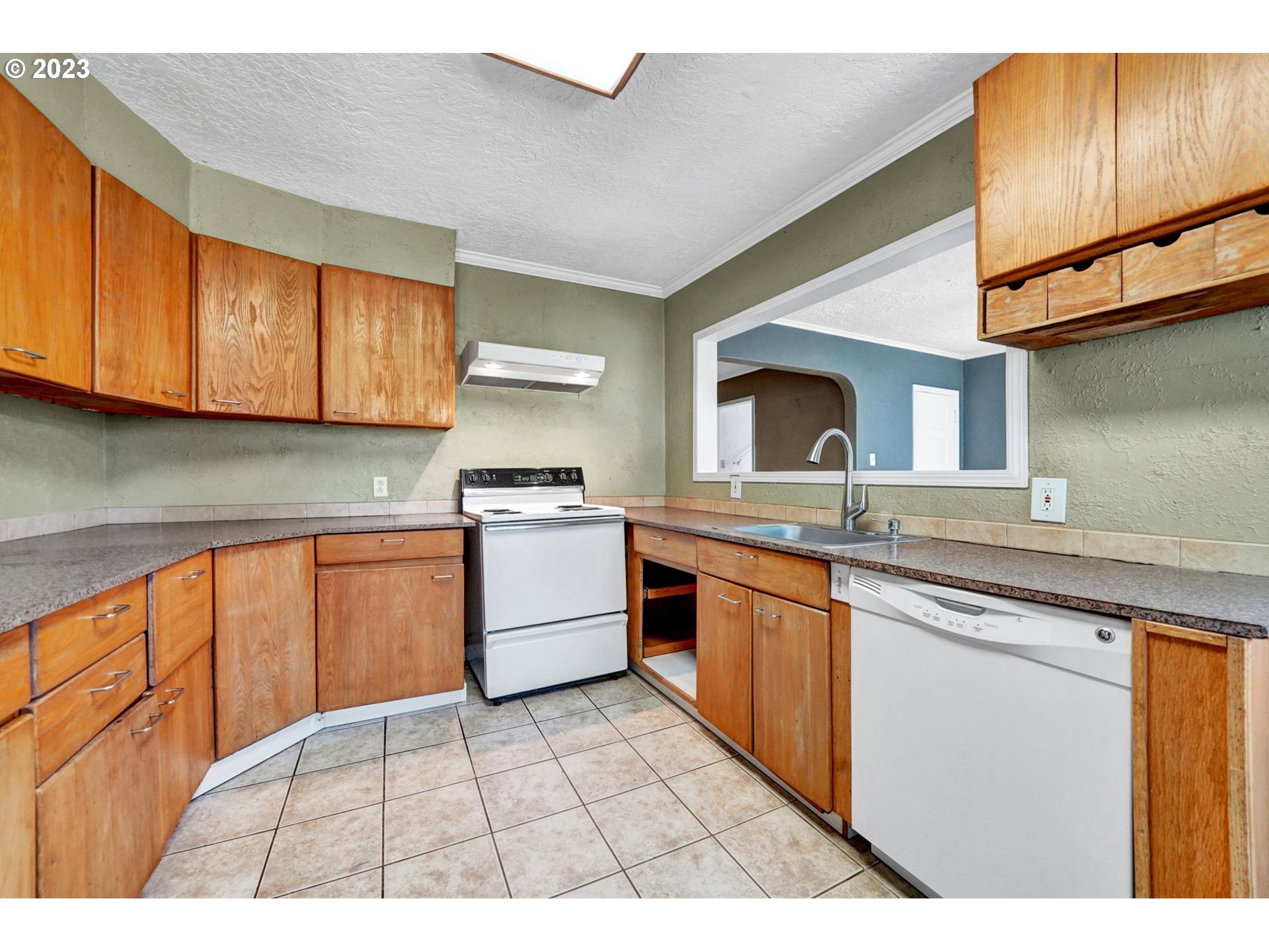 661 18th Avenue Longview, WA 98632 - Photo 13 of 39 a kitchen with stainless steel appliances granite countertop a sink and cabinets