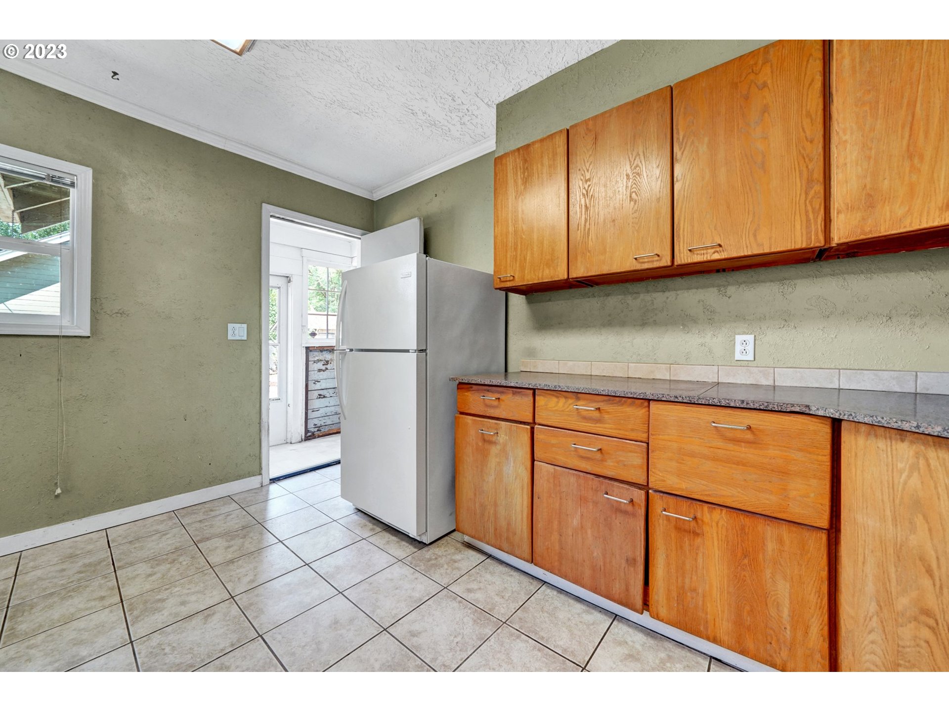 661 18th Avenue Longview, WA 98632 - Photo 14 of 39 a kitchen with stainless steel appliances granite countertop a refrigerator sink and cabinets
