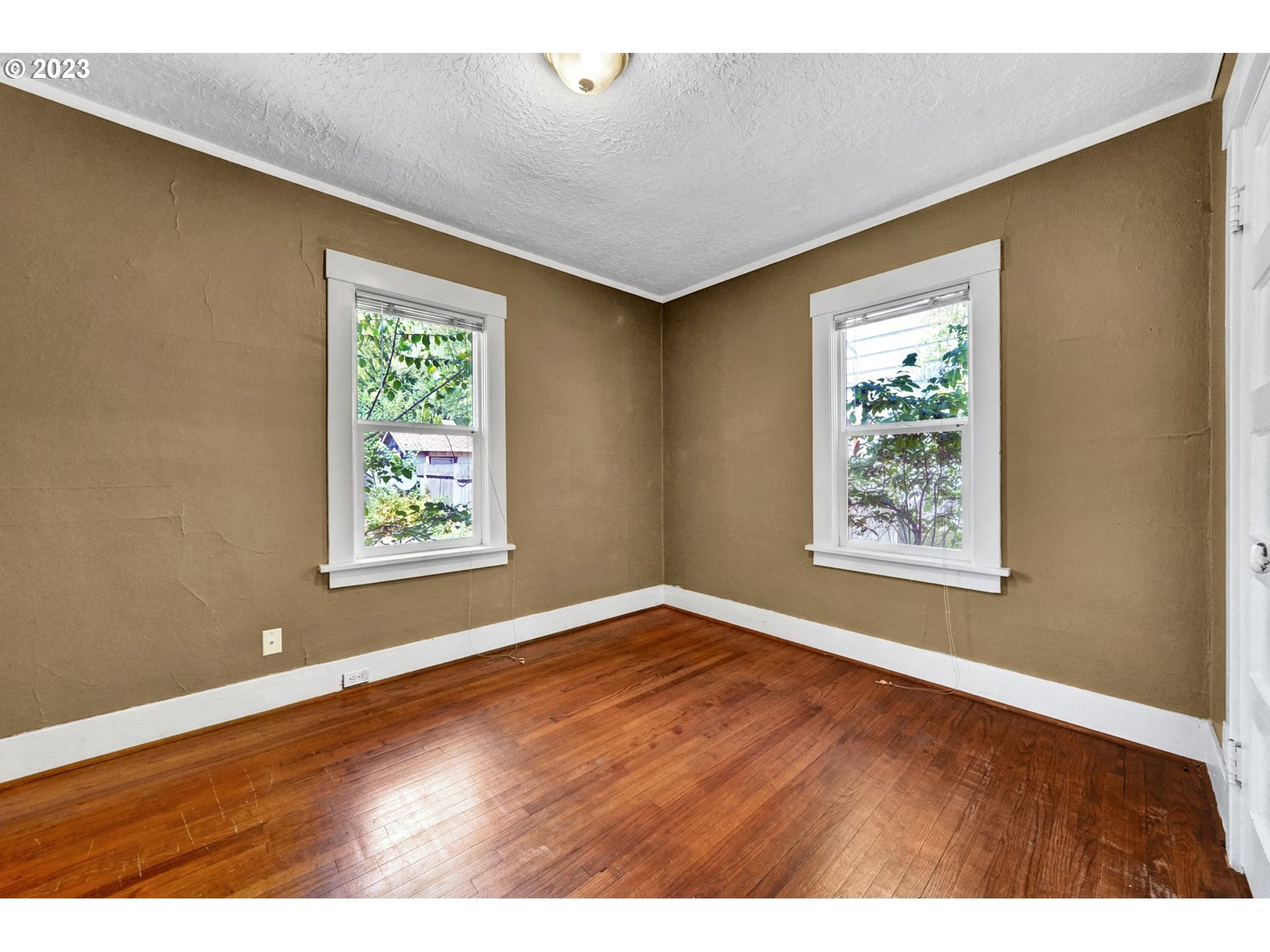 661 18th Avenue Longview, WA 98632 - Photo 21 of 39 en empty room with window and wooden floor