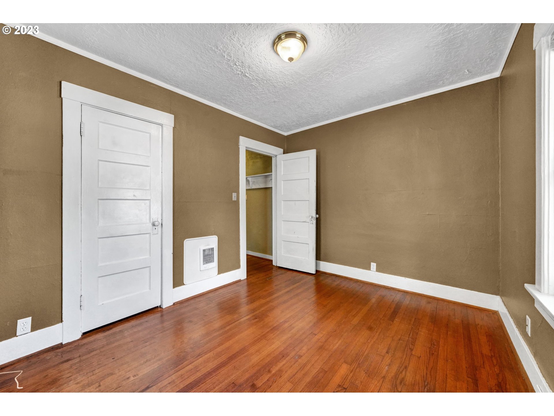 661 18th Avenue Longview, WA 98632 - Photo 22 of 39 a view of an empty room with wooden floor