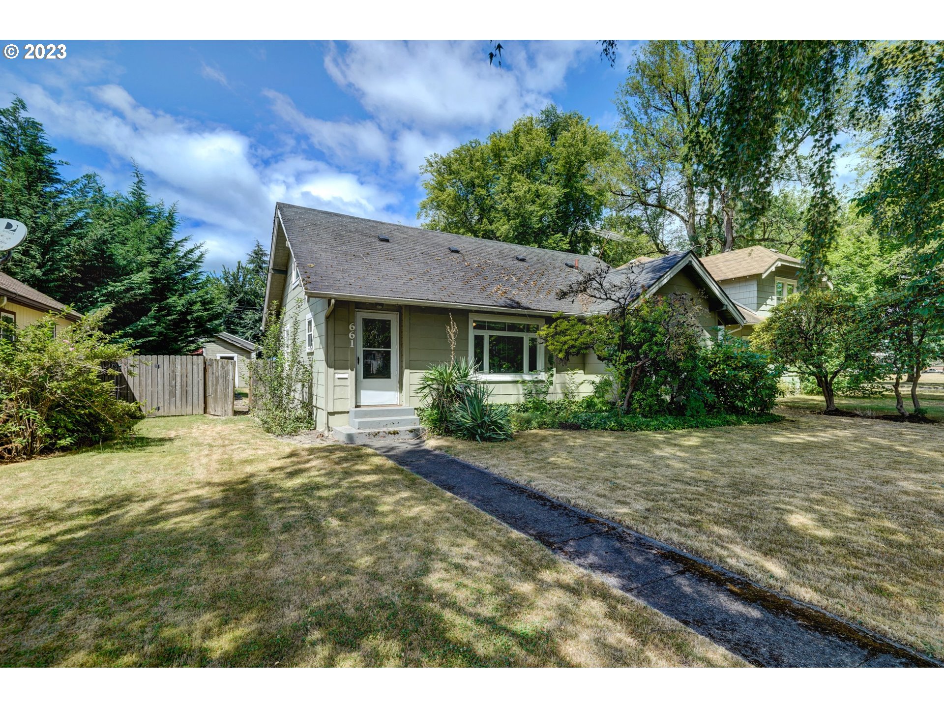 661 18th Avenue Longview, WA 98632 - Photo 3 of 39 a view of a house with a yard and potted plants