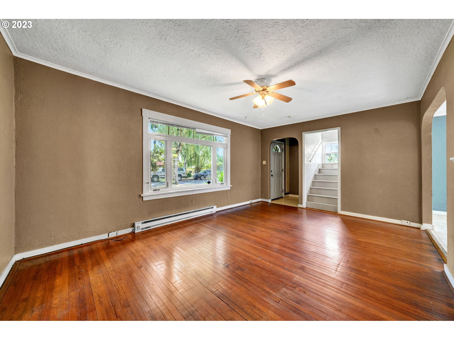661 18th Avenue Longview, WA 98632 - Photo 6 of 39 an empty room with window and wooden floor
