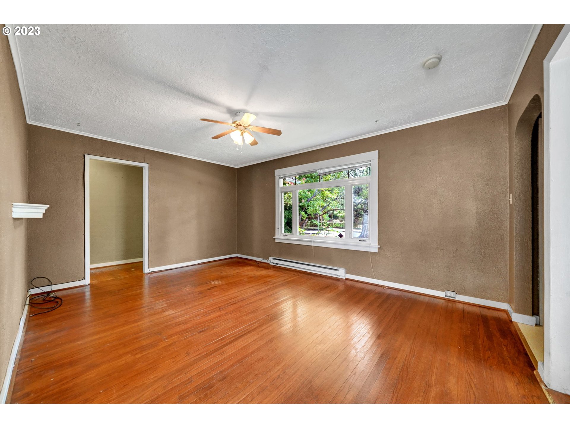 661 18th Avenue Longview, WA 98632 - Photo 7 of 39 an empty room with wooden floor and window