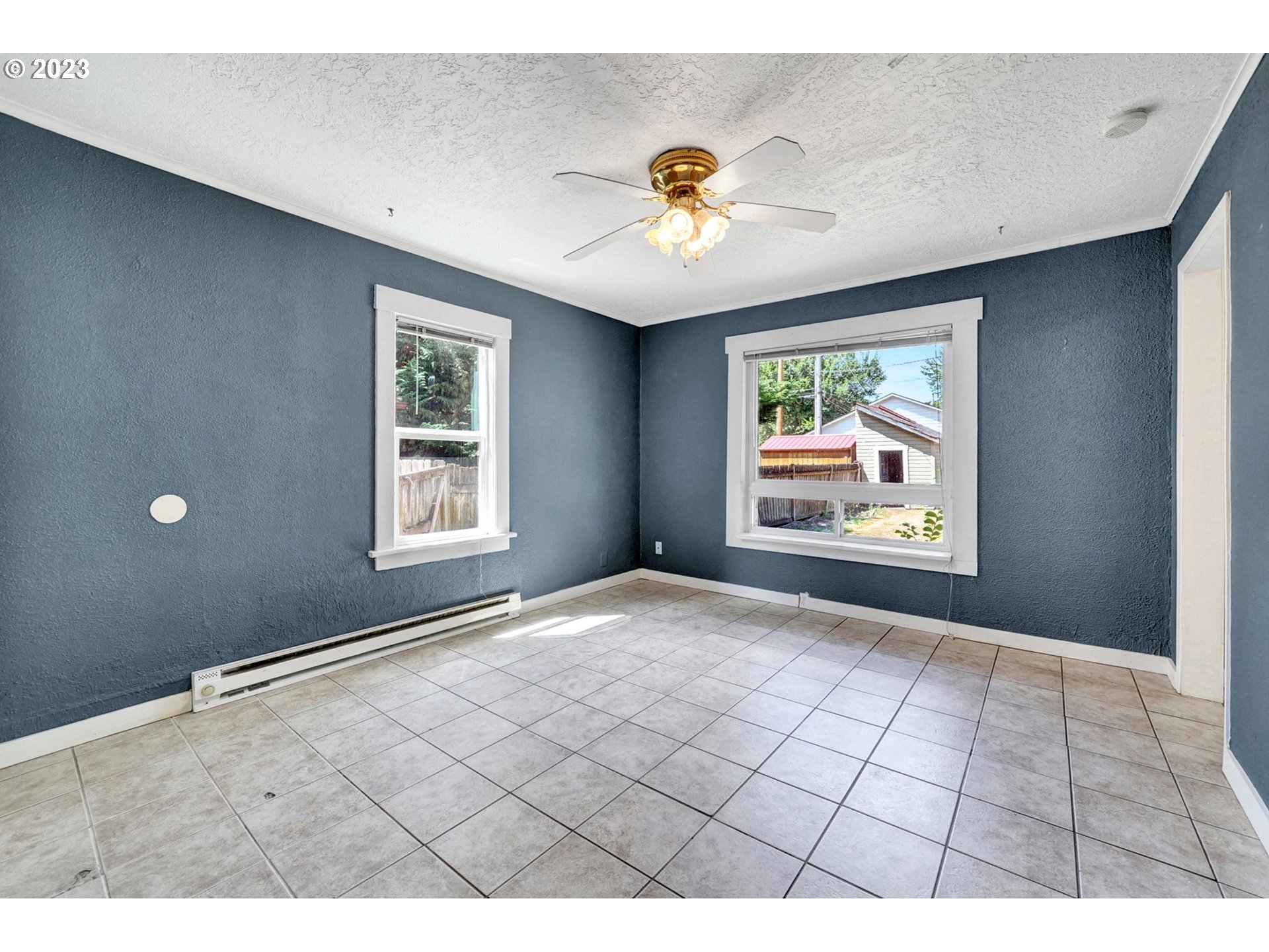 661 18th Avenue Longview, WA 98632 - Photo 8 of 39 a view of an empty room with window and wooden floor