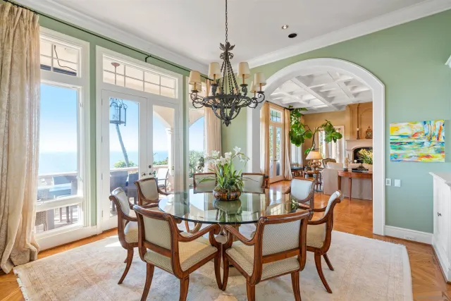 a kitchen with stainless steel appliances granite countertop a sink a stove and a wooden floors