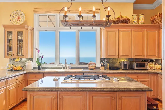 a living room with furniture and floor to ceiling window