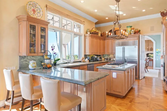 a view of a dining room with furniture large windows and wooden floor