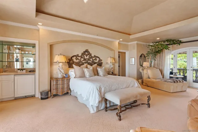 a bedroom with furniture and a fireplace