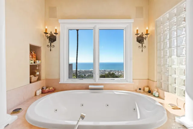 a large bathroom with a glass door shower