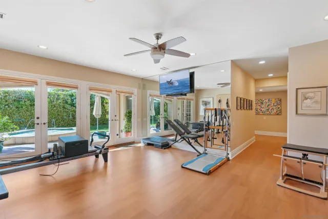 a living room with furniture a rug and a chandelier