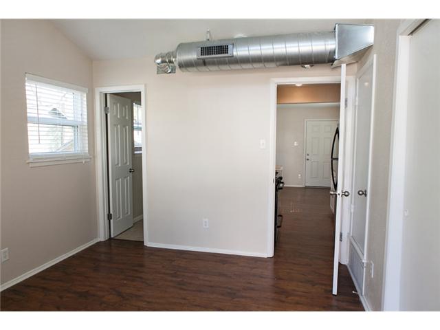 1106 West 22nd Street, Unit 4 Austin, TX 78705 - Photo 4 of 12 a view of empty room with wooden floor