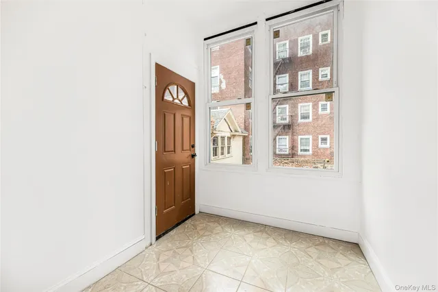 a view of a hallway with stairs