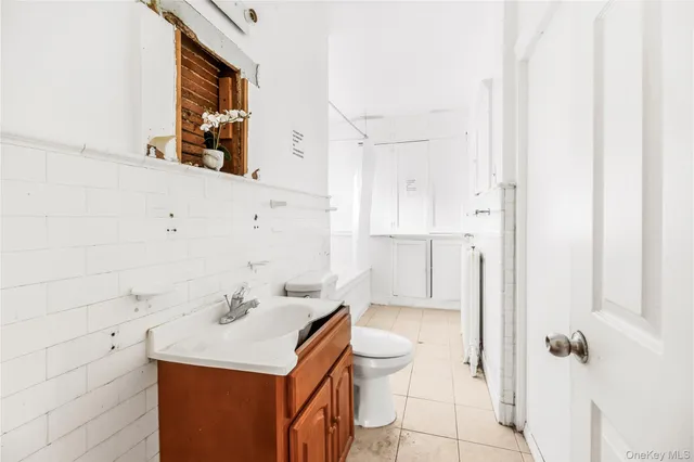 a bathroom with a shower and a glass door