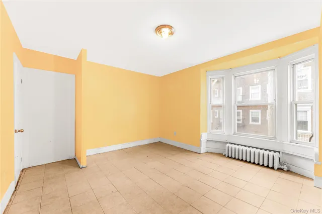 a view of a big room with windows and closet