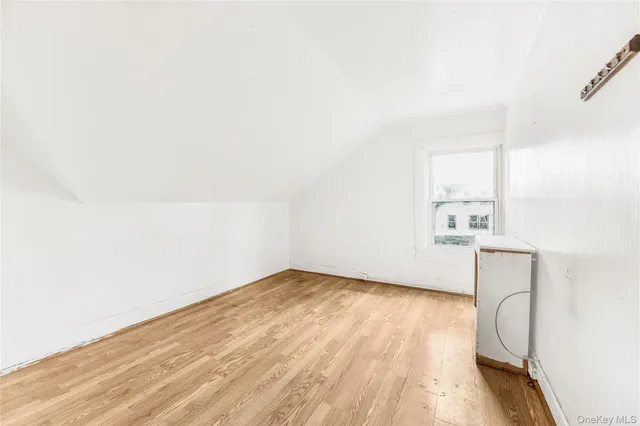 a bathroom with a tub sink and a mirror
