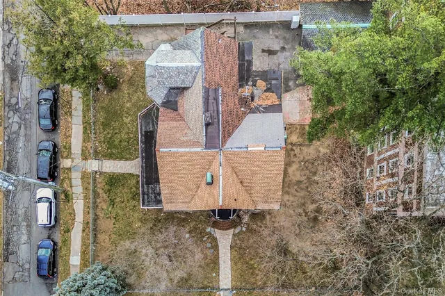 a view of a balcony with wooden floor and fence