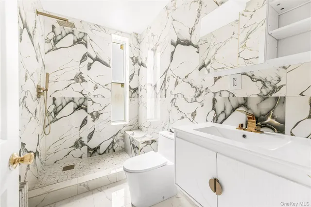 a view of a livingroom with wooden floor fireplace and windows