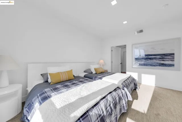 a view of a balcony from an empty room