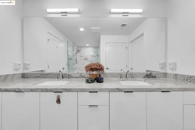 a bedroom with a bed and a chair