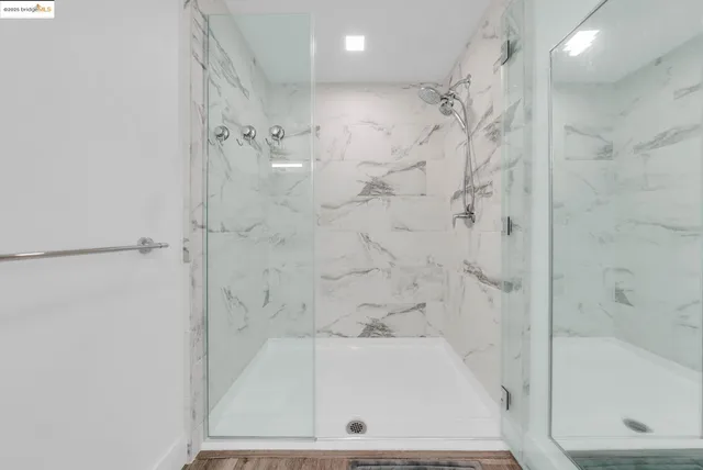 a hallway with sink and mirror