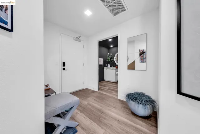 a room with furniture and view of bathroom